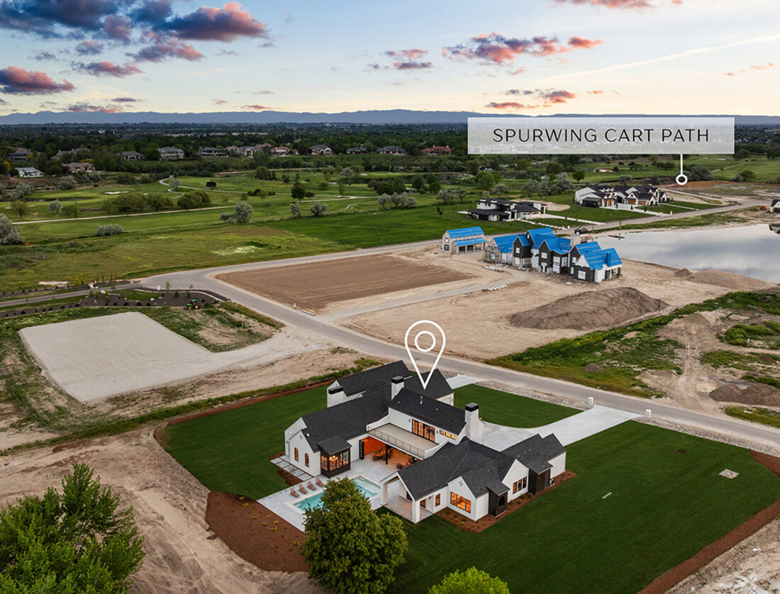 Custom estate home at dusk in Spurwing Acres
